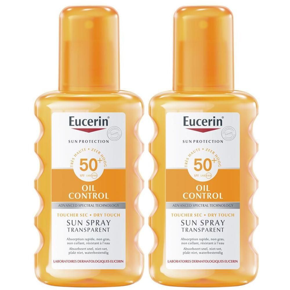 Twee flessen Eucerin Sun Oil Control SPF 50+ Dry Touch Spray Transparent. Oranje flessen met groene etiketten.
