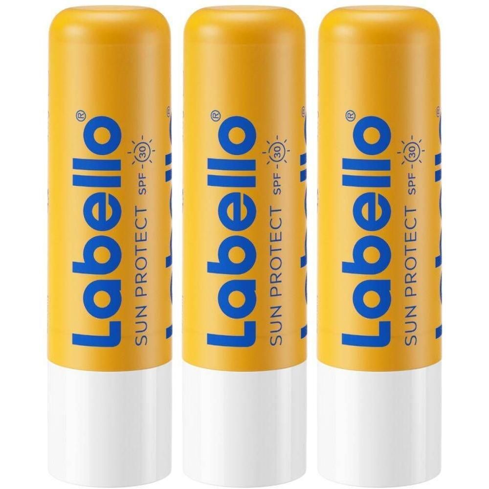 Drie Labello Sun Protect SPF30 lippenstiften. Gele hulzen met blauwe tekst. Witte onderkant.