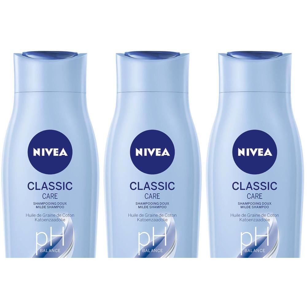 Drie lichtblauwe shampoo flessen. Op elke fles staat NIVEA, CLASSIC CARE, pH BALANCE. Tekst: Shampooing doux, Huile de Graine de Coton.