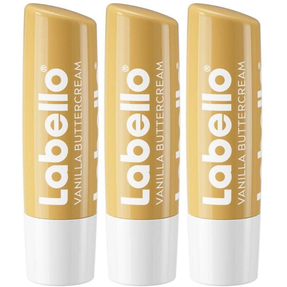Drie gouden lippenstiften met witte basis. Opschrift: Labello Vanilla Buttercream.