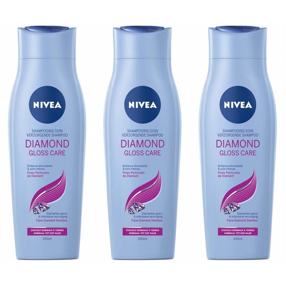 Drie flessen Nivea Diamond Gloss Care shampoo. Lichtblauwe flessen met blauwe doppen en etiketten. Opschrift: Diamond Gloss Care.