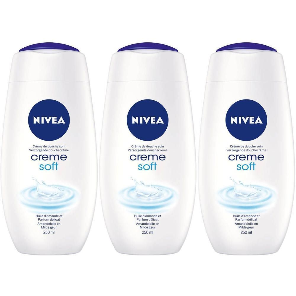 Trois flacons blancs Nivea Crème Soft Crème de Douche. Bouchons et logos bleus. Texte en français: Crème de Douche soin, creme soft, 250 ml.
