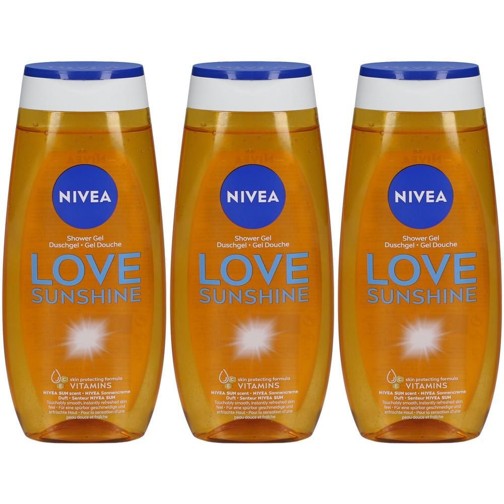 Drie flessen douchegel met blauwe dop. Opschrift: NIVEA, LOVE SUNSHINE. Gele vloeistof. Opschrift: Shower Gel, Duschgel, Gel Douche.