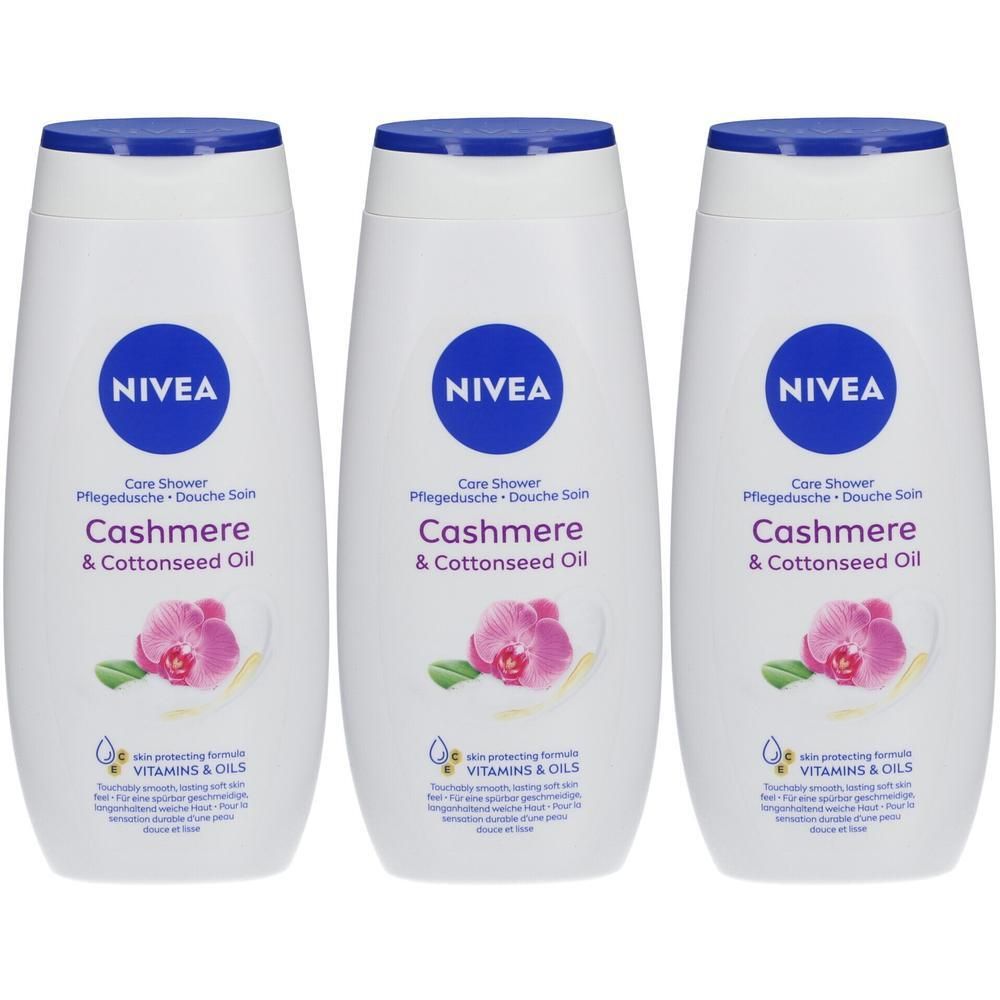 Drie witte NIVEA douchegels met blauwe doppen. Opschrift: Cashmere & Cottonseed Oil. Met logo en bloemen design.