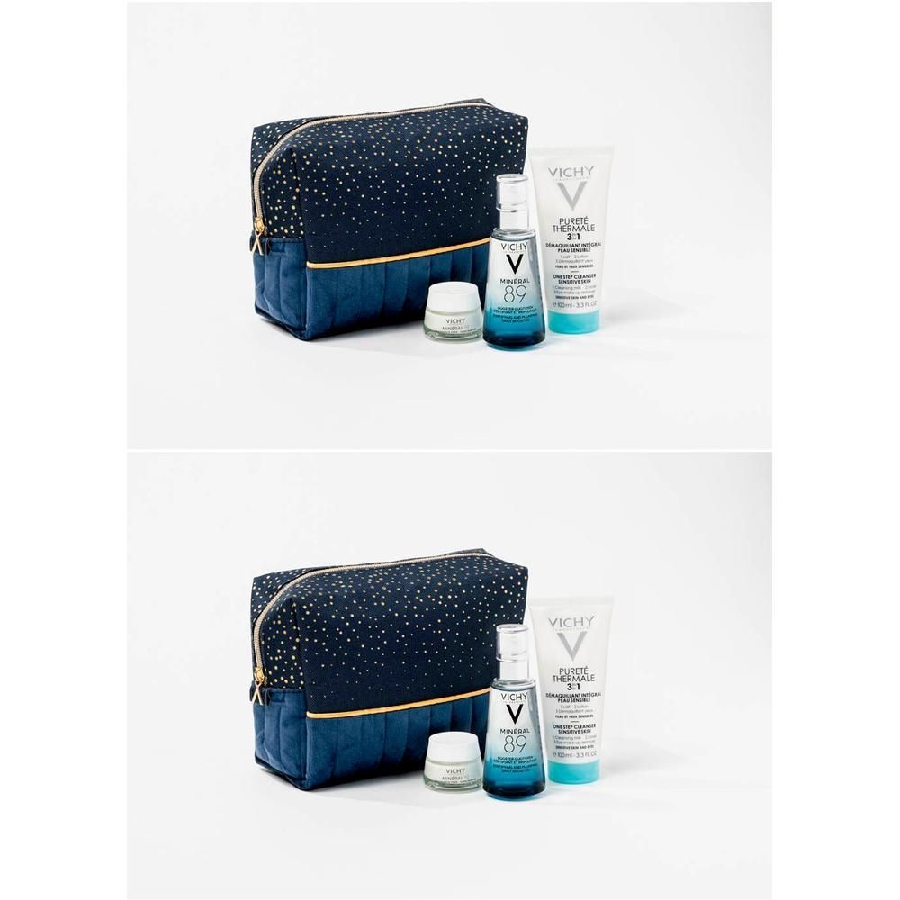 Trousse de toilette avec produits. Comprend une bouteille, un tube et un pot. Le nom Vichy est visible sur les produits.