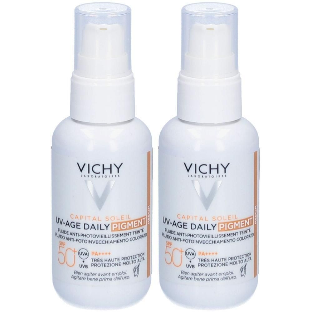 Deux flacons blancs avec pompe. Inscription: Vichy Capital Soleil UV-Age Daily Pigment SPF50+. Texte en français et italien.