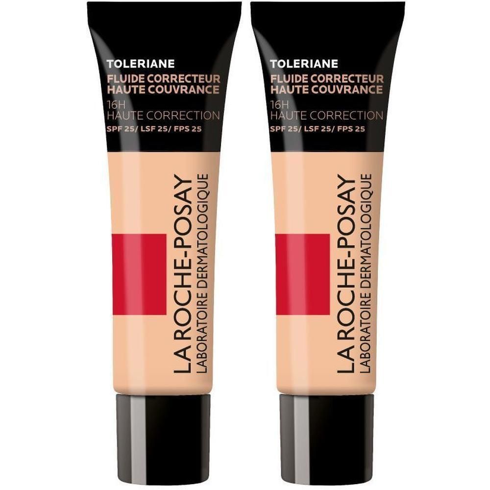 Twee tubes La Roche-Posay Toleriane Fluide Correcteur. Zwarte dop, beige tube met rode streep en tekst.