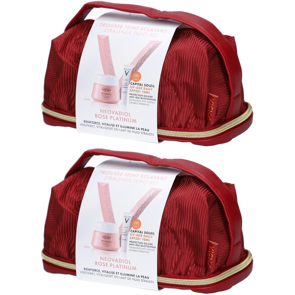 Deux trousses de maquillage rouges avec fermeture éclair dorée et poignée. Une étiquette avec des informations sur le produit est visible.