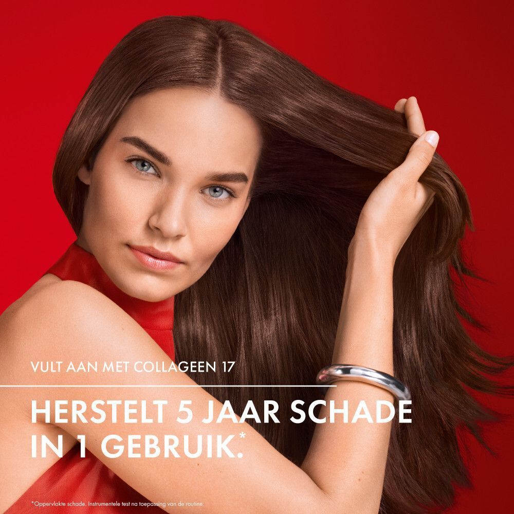 Vrouw met bruin haar. Ze raakt haar haar aan. Tekst: Herstelt 5 jaar schade in 1 gebruik.