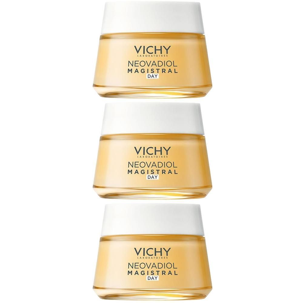 Drie potten Vichy Neovadiol Magistral Day crème. Gele crème in glazen potten met witte deksel.