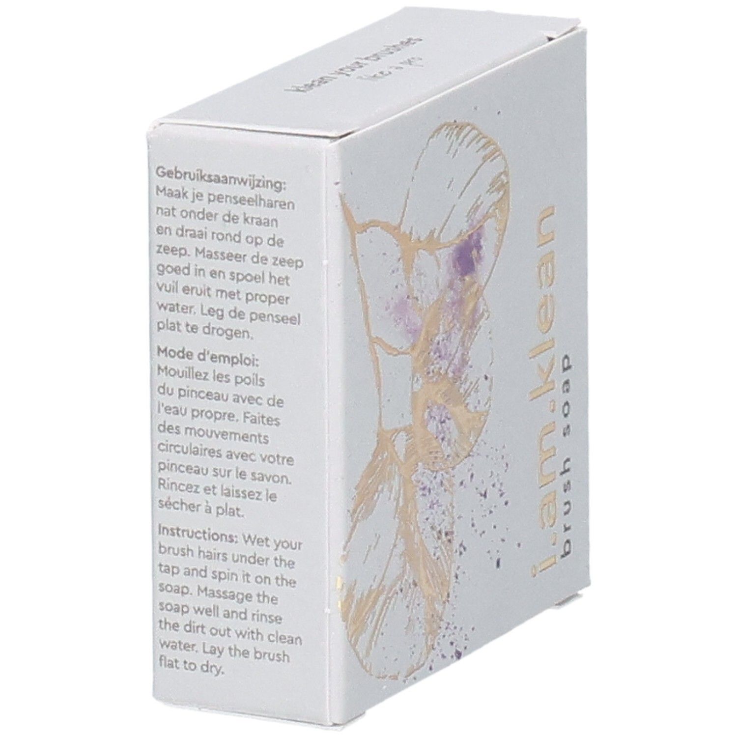 Schuinstaande kartonnen verpakking met bloemmotief. Opschrift i.am.klean Brush Soap. Instructies in meerdere talen.