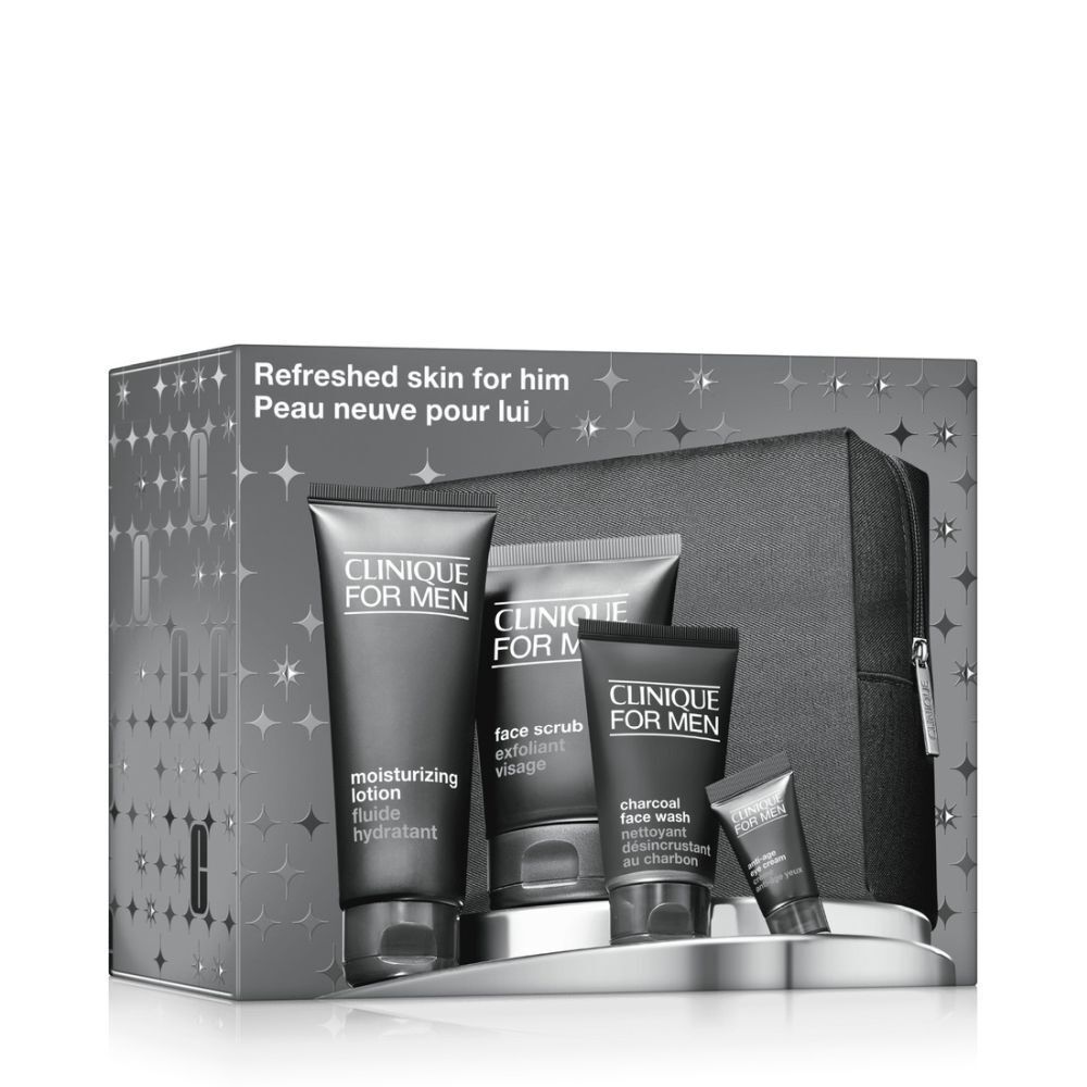 Coffret de produits cosmétiques pour hommes. Contient des tubes et une trousse de toilette noire. Emballage avec motif d'étoiles.