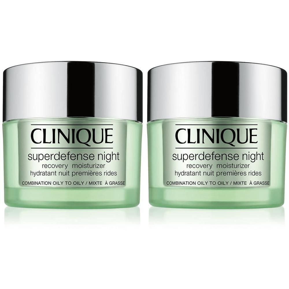 Twee groene crèmetiegels met zilveren deksels. Op de voorkant staat "CLINIQUE superdefense night recovery moisturizer".