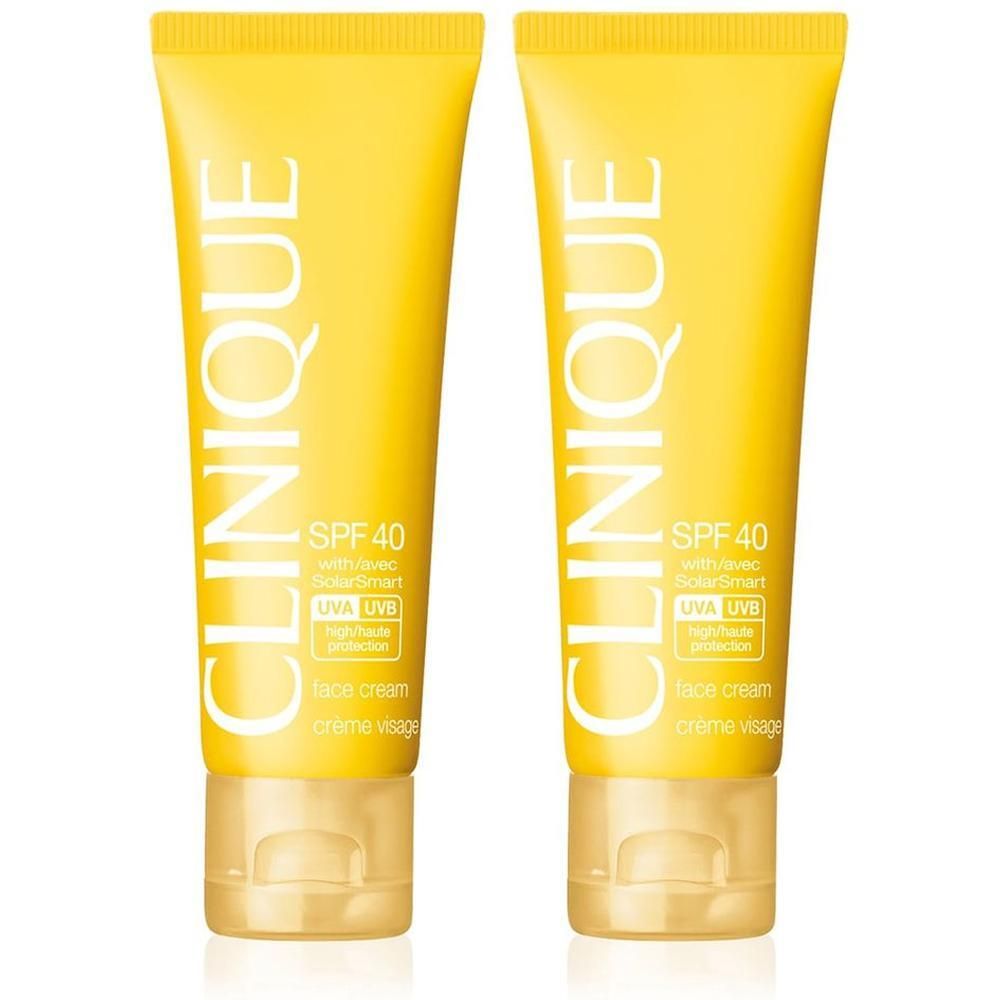 Deux tubes jaunes de crème solaire CLINIQUE SPF 40 pour le visage.