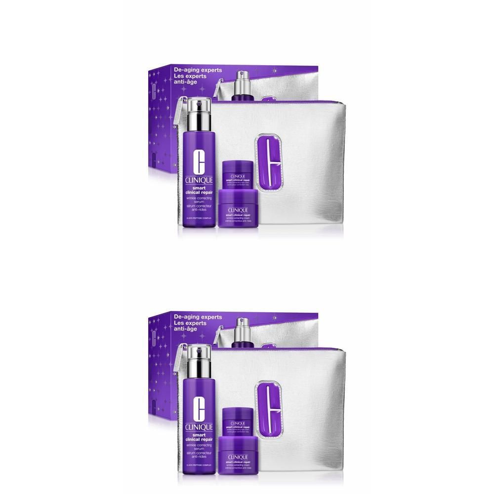 Clinique geschenkset met paarse flacons en potjes, zilveren toilettas en verpakking. Merk Clinique zichtbaar.