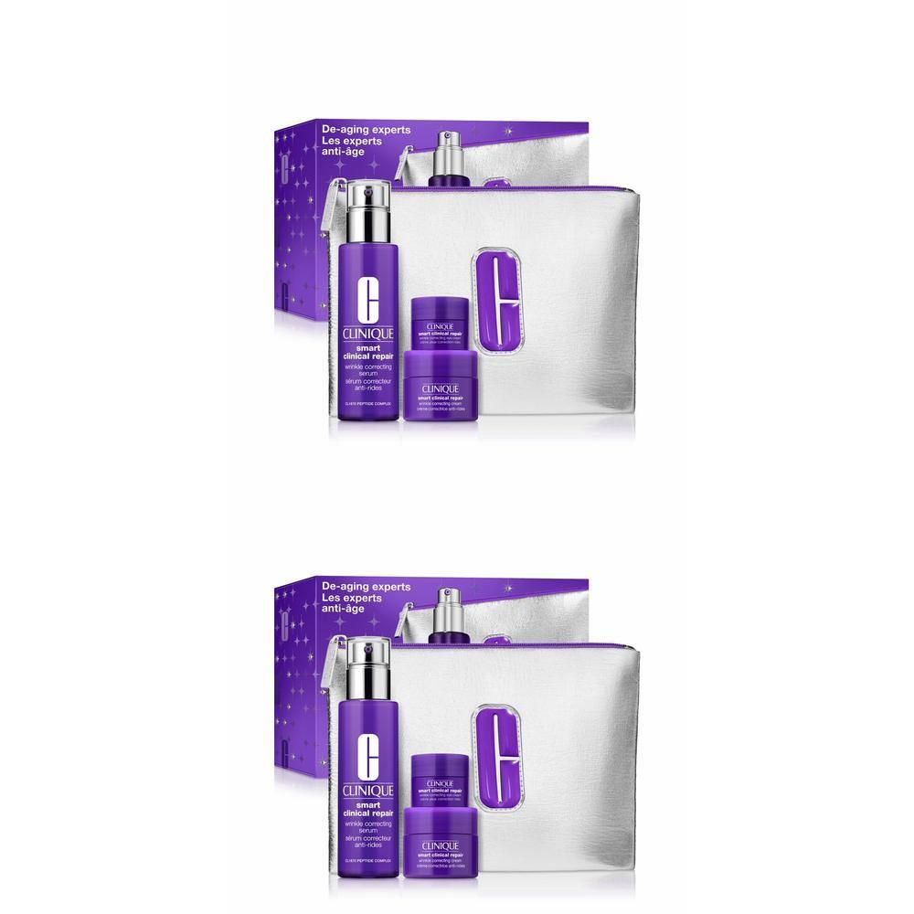 Clinique Smart Clinical Repair set met serum en crèmes in paarse verpakking en zilveren toilettas.