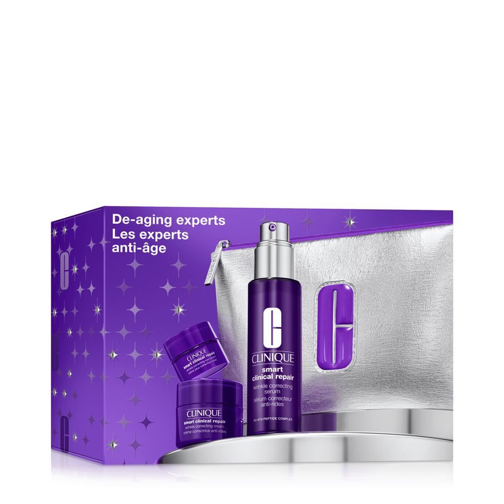 Clinique Smart Clinical Repair set met serum en crèmes in paarse verpakking en zilveren toilettas.