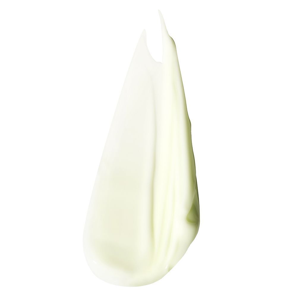 Une texture crémeuse vert pâle de CLINIQUE Redness Solutions Soothing Cleanser.