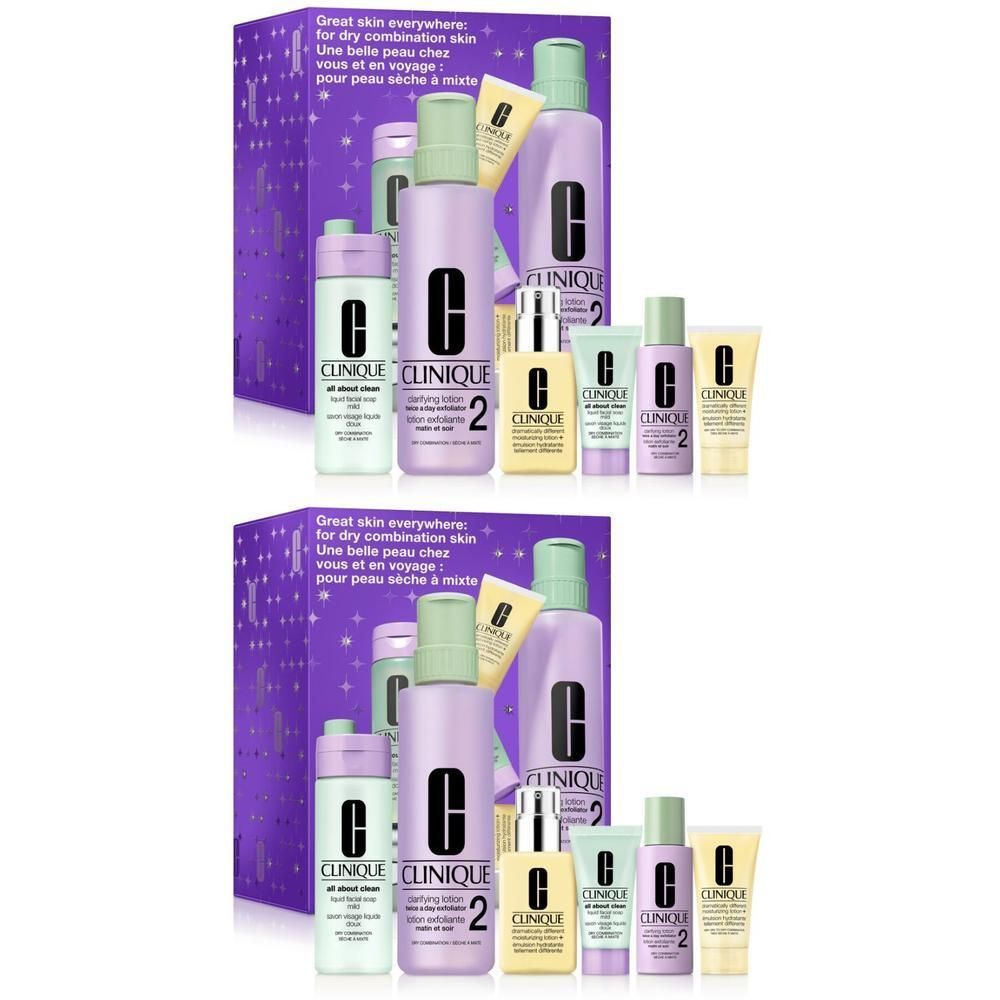 Coffret cadeau Clinique avec plusieurs produits de soin. Contient des flacons, des tubes et un emballage violet avec des étoiles et des noms de produits.