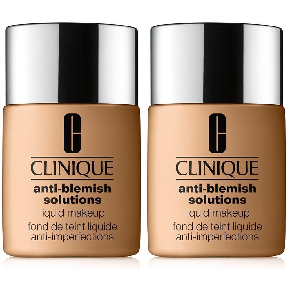 Twee flacons CLINIQUE Anti-Blemish Solutions. Beige flacons met zilveren dop. Zwarte belettering.
