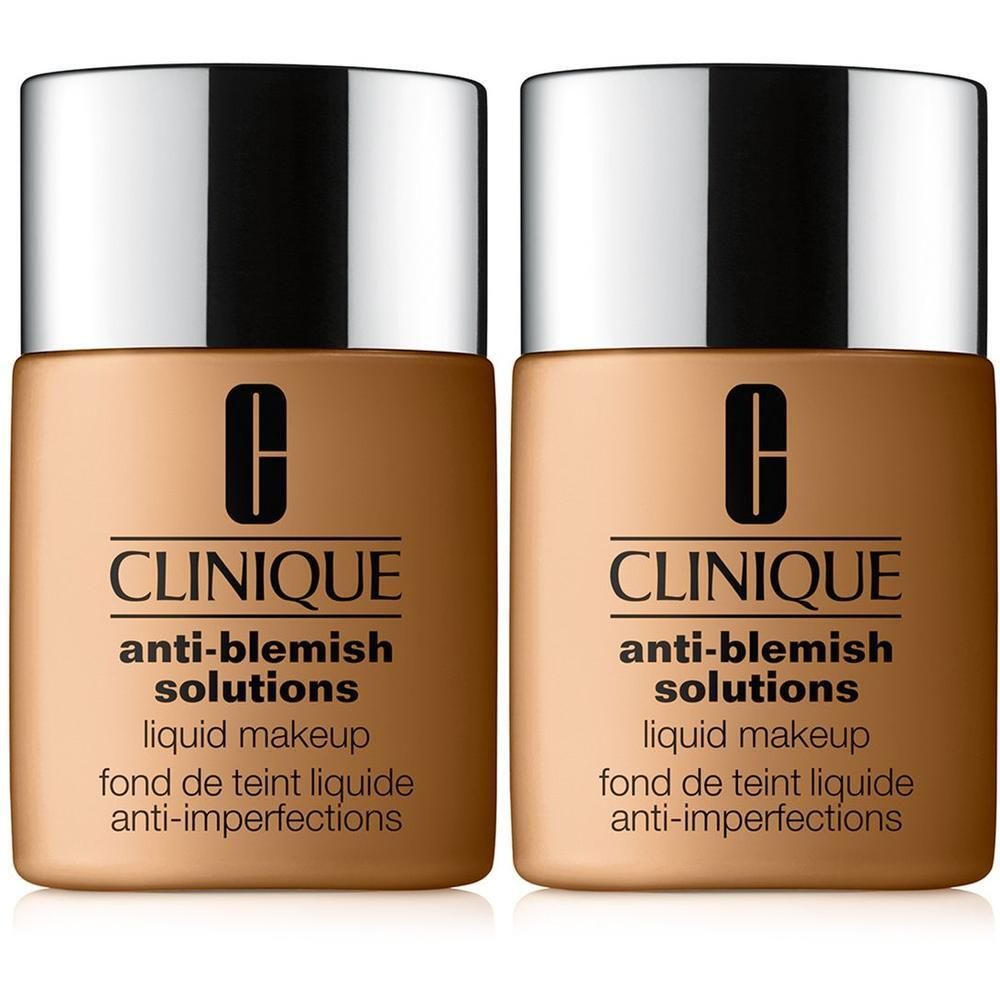 Deux flacons de fond de teint liquide CLINIQUE Anti-Blemish Solutions. Teinte beige. Inscription noire sur fond beige. Bouchon argenté.
