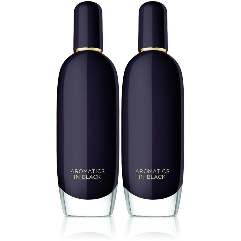 Deux flacons Clinique Aromatics in Black. Flacons ovales bleu foncé avec bouchons noirs et bagues dorées.