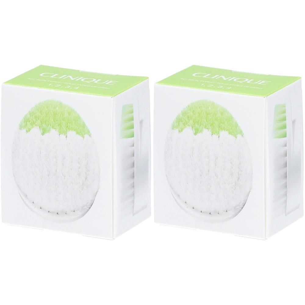 Deux têtes de brosse CLINIQUE Sonic System dans leurs emballages individuels.