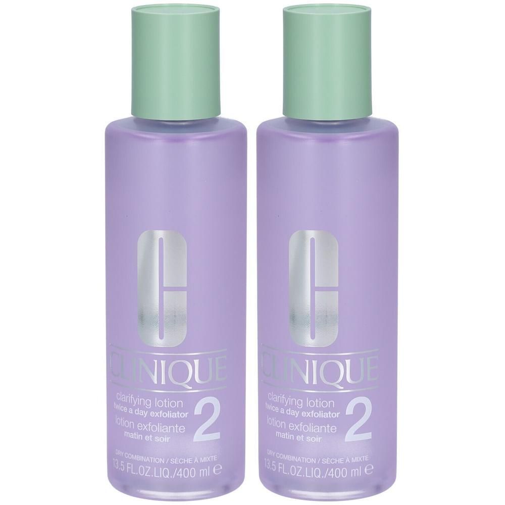 Twee flessen Clinique Lotion clarifiante Step-2. Paarse flessen met groene doppen. Opschrift Clinique en nummer 2.