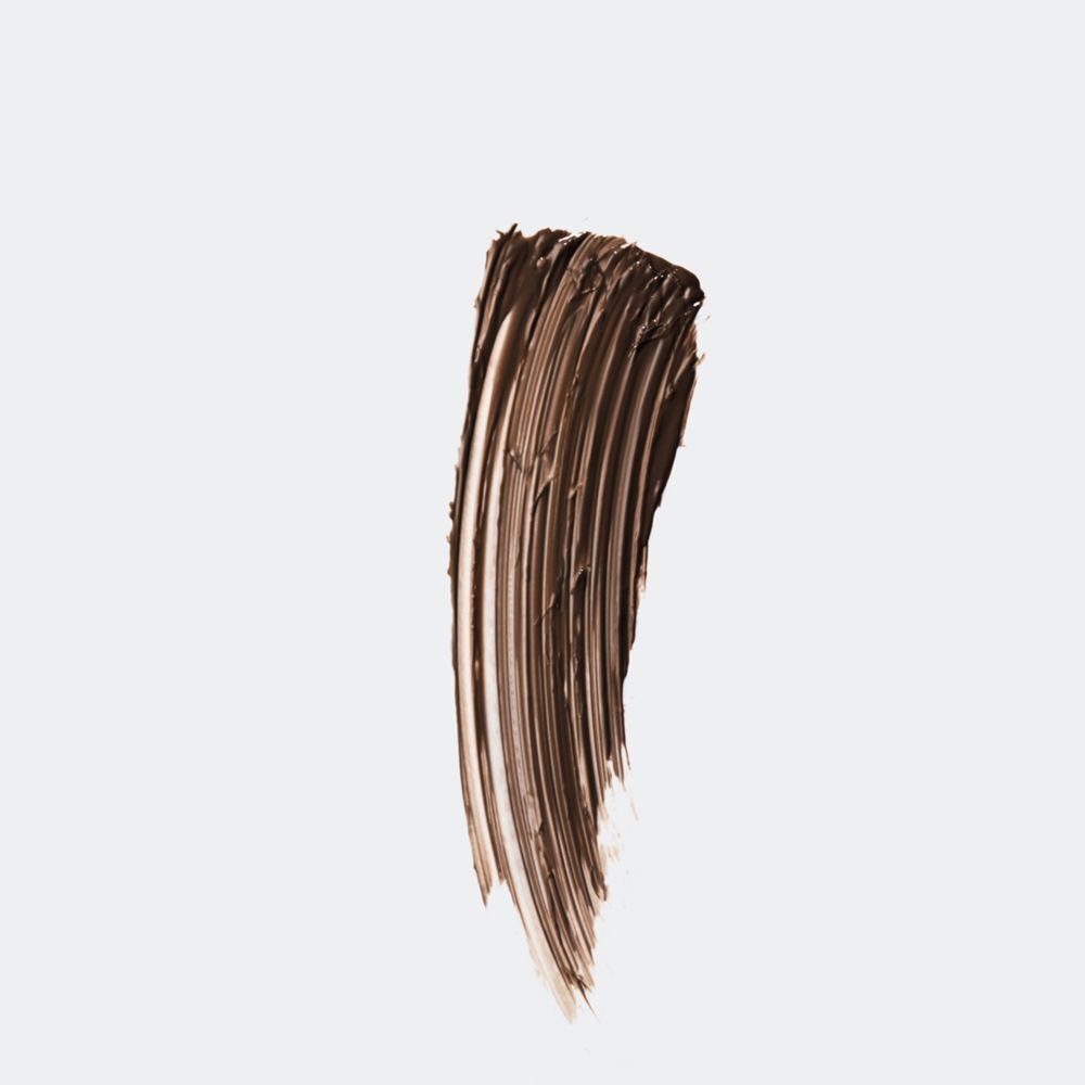 Een bruine veeg van de Clinique Just Browsing™ getinte volumizing gel.
