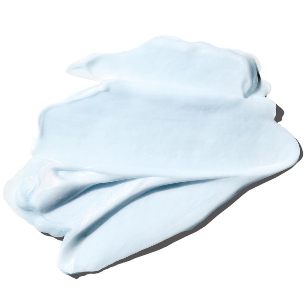 Une texture crémeuse bleu clair étalée sur une surface.