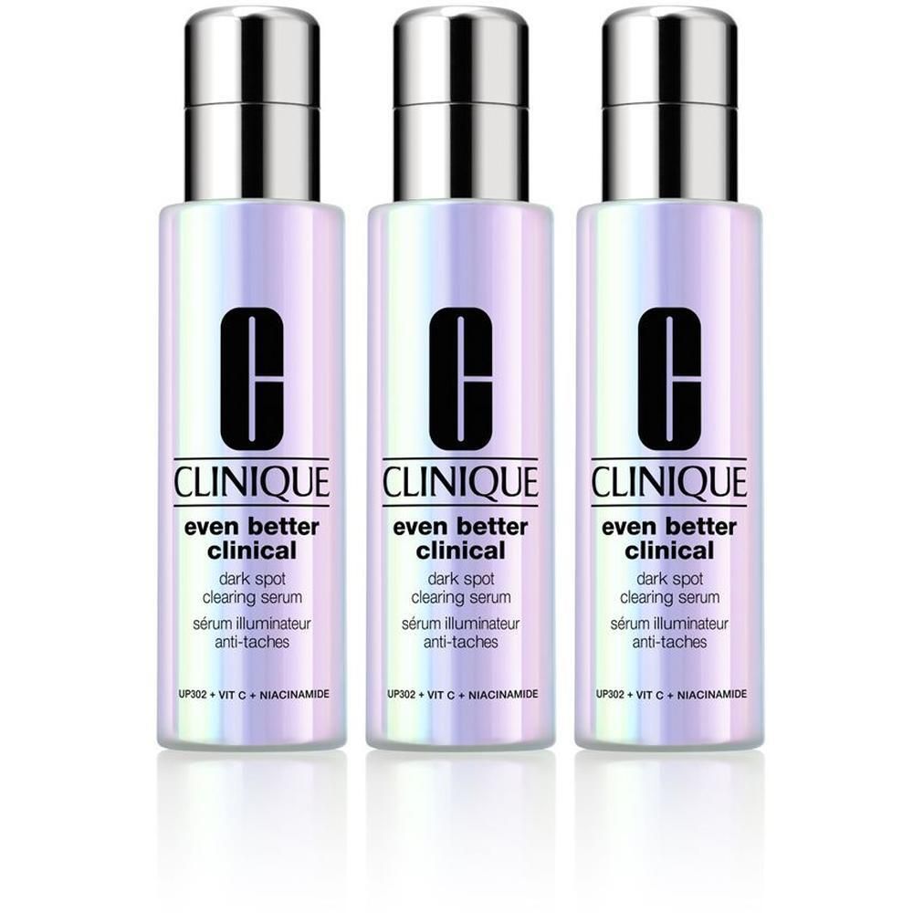 Drie flacons Clinique Even Better Clinical serum met iriserende afwerking en zilveren doppen.