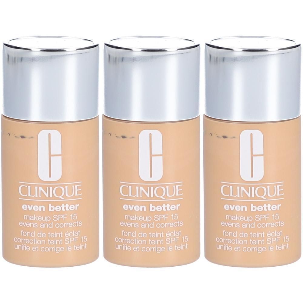 Drie flacons CLINIQUE Even Better foundation, beige, met zilveren doppen. Tekst: SPF 15, evens and corrects.