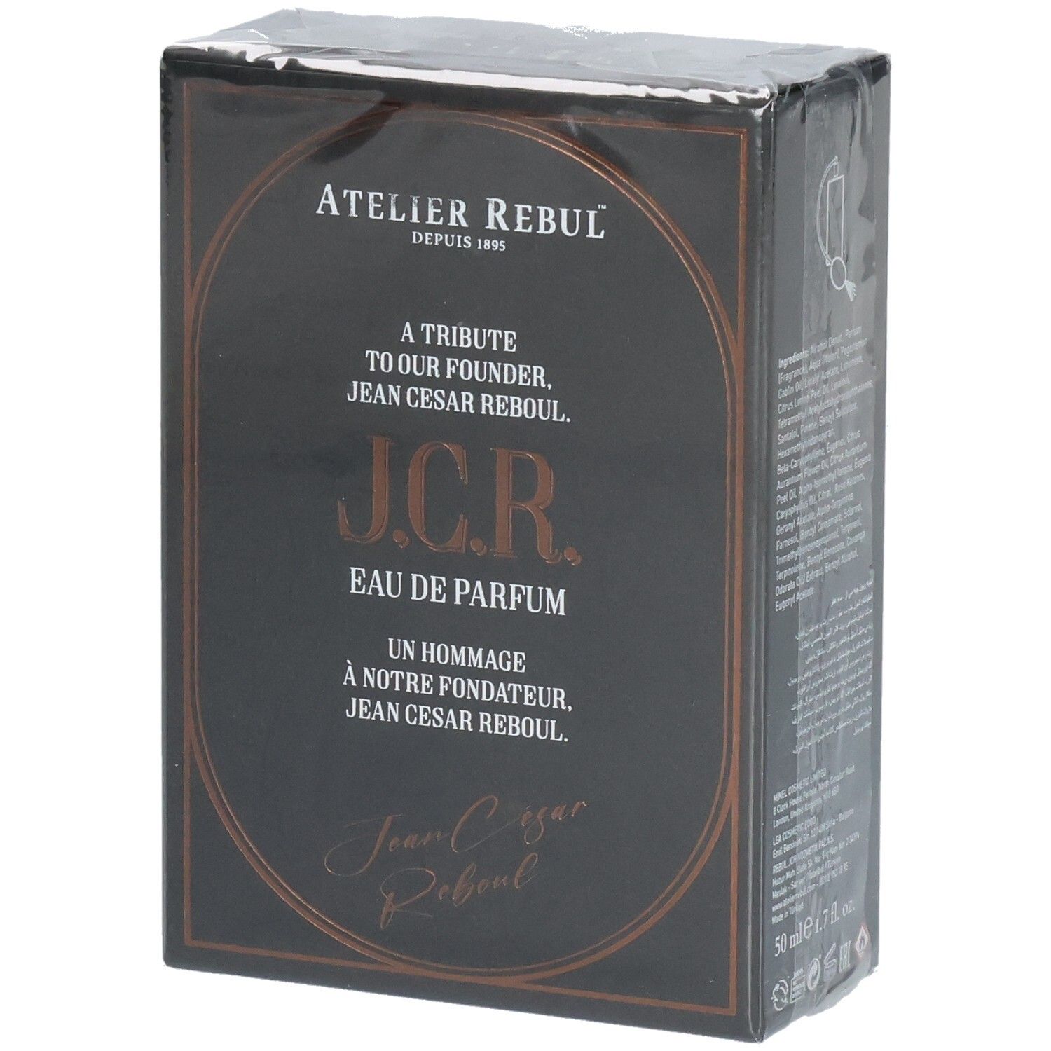 Boîte de parfum noire avec inscription dorée. Présente Atelier Rebul J.C.R. Eau de Parfum.