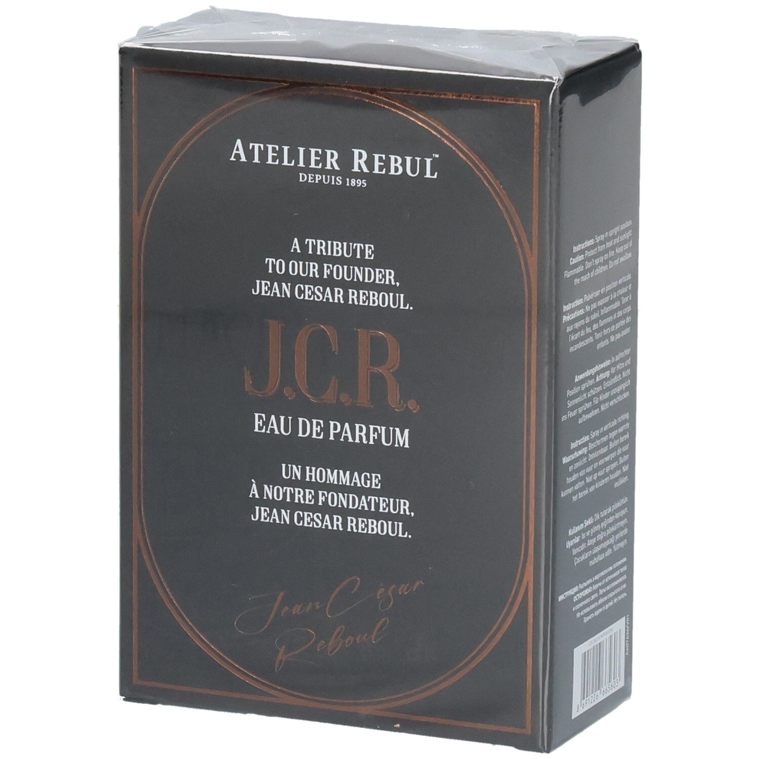 Boîte de parfum noire avec inscription dorée. Présente Atelier Rebul J.C.R. Eau de Parfum.