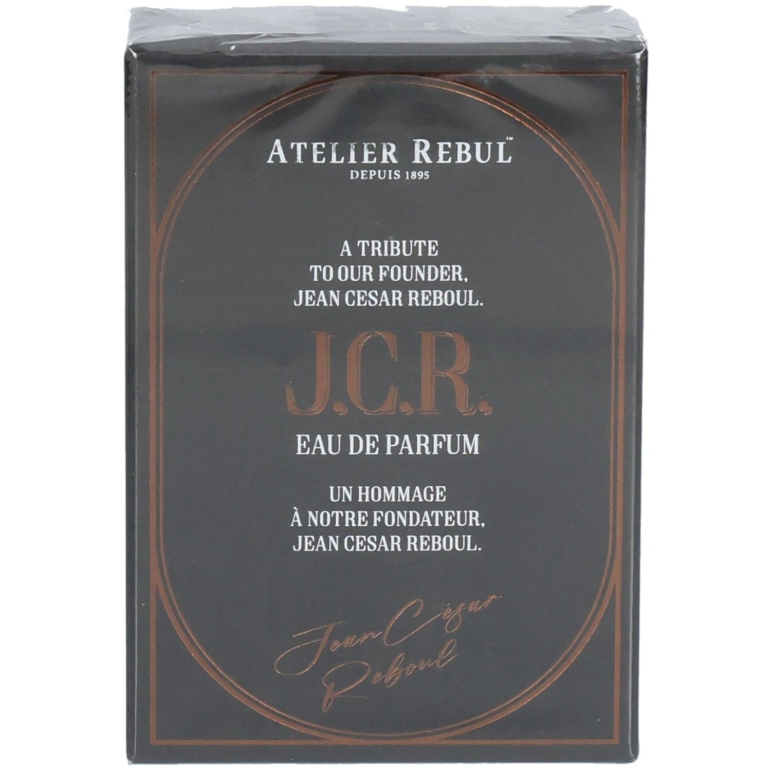 Boîte de parfum noire avec inscription dorée. Présente Atelier Rebul J.C.R. Eau de Parfum.