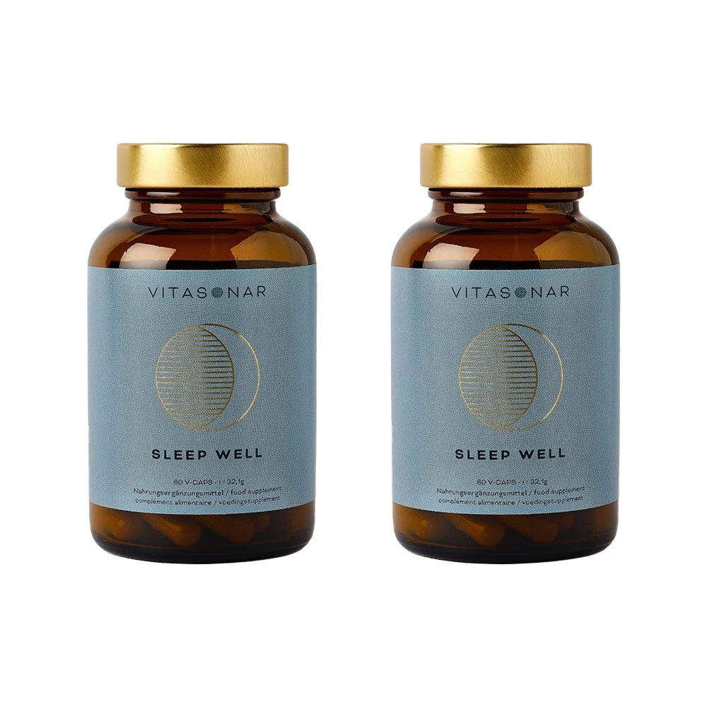 Twee bruine glazen flessen met gouden doppen. Blauwe etiketten met "VITASONAR", maansymbool en "SLEEP WELL".