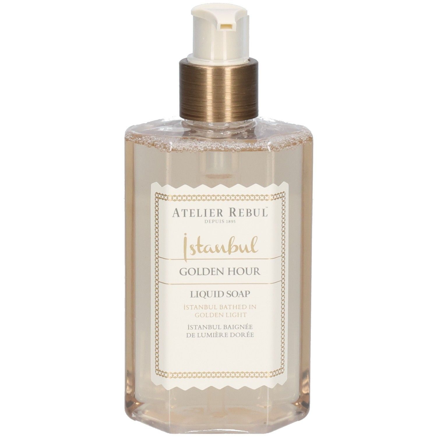 Savon liquide dans un flacon hexagonal transparent avec pompe dorée. L'étiquette indique "Istanbul Golden Hour".