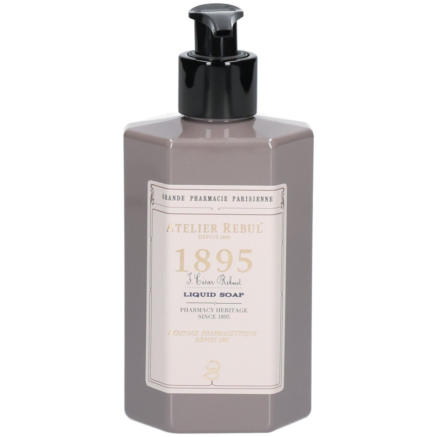 Grijze zeepdispenserfles met zwarte pomp en etiket met "Atelier Rebul Liquid Soap".