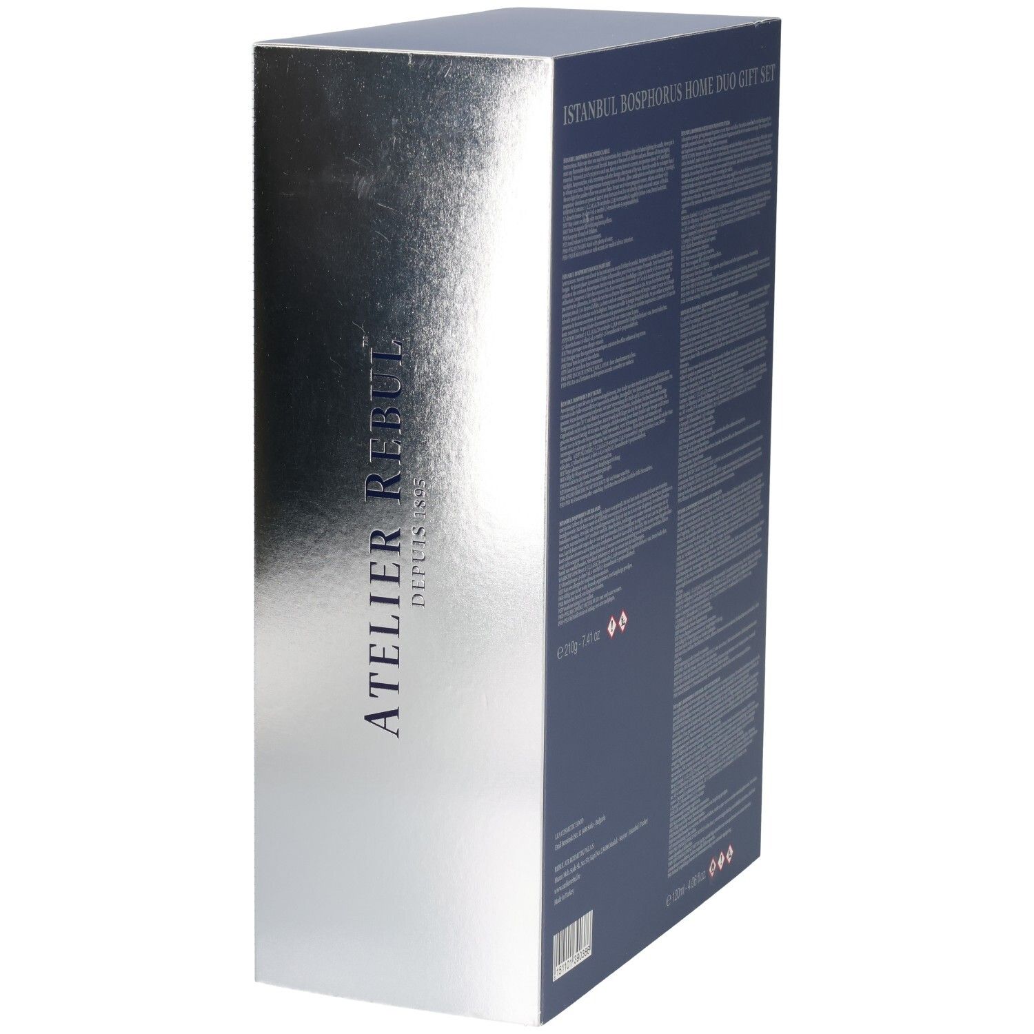 Zijaanzicht van een cadeaubox met zilveren metallic afwerking en verticale Atelier Rebul tekst.