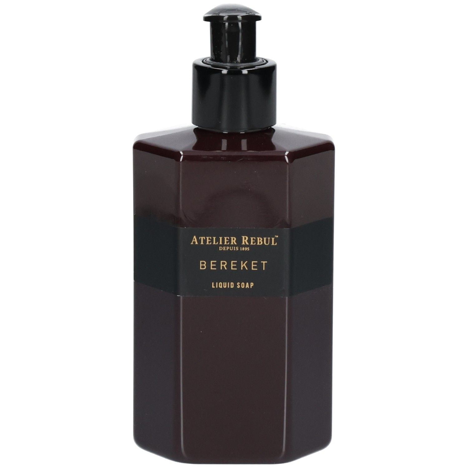 Donkerbruine achthoekige fles met zwarte pompdispenser. Zwart etiket met gouden tekst: Atelier Rebul, BEREKET, LIQUID SOAP.