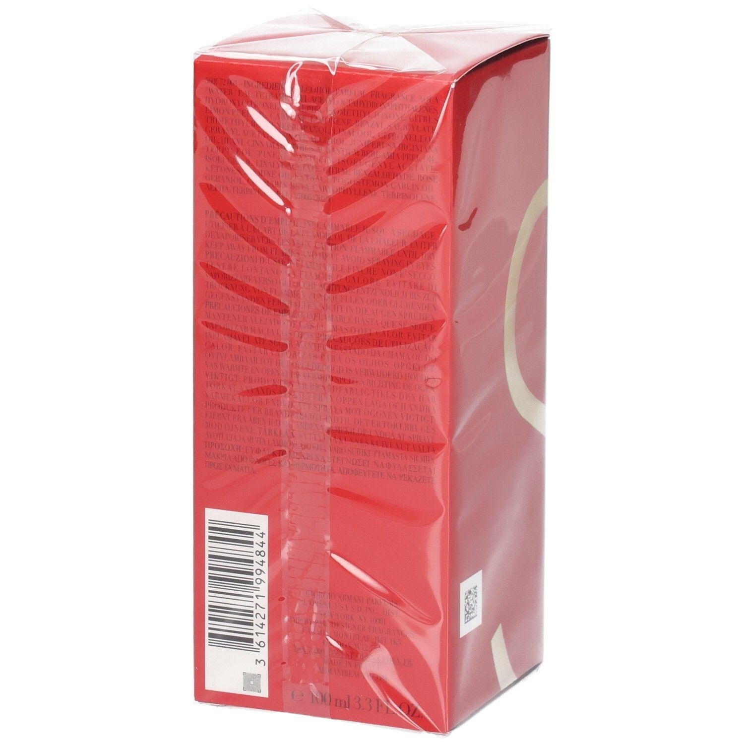 Rode doos met barcode en gouden cirkelontwerp, verpakt in doorzichtige folie.