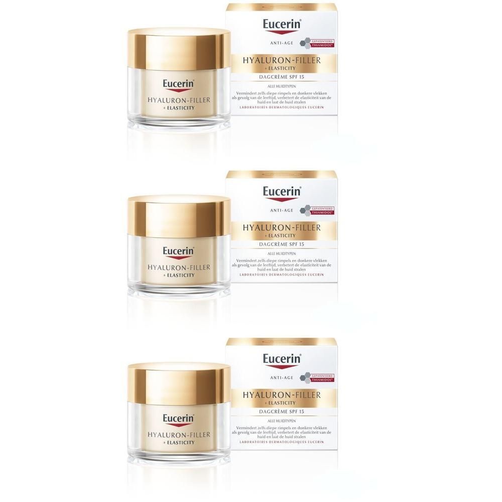 Drie potjes Eucerin Hyaluron-Filler + Elasticity Soin de Jour SPF15 en verpakkingen. Gouden deksels, witte verpakking.