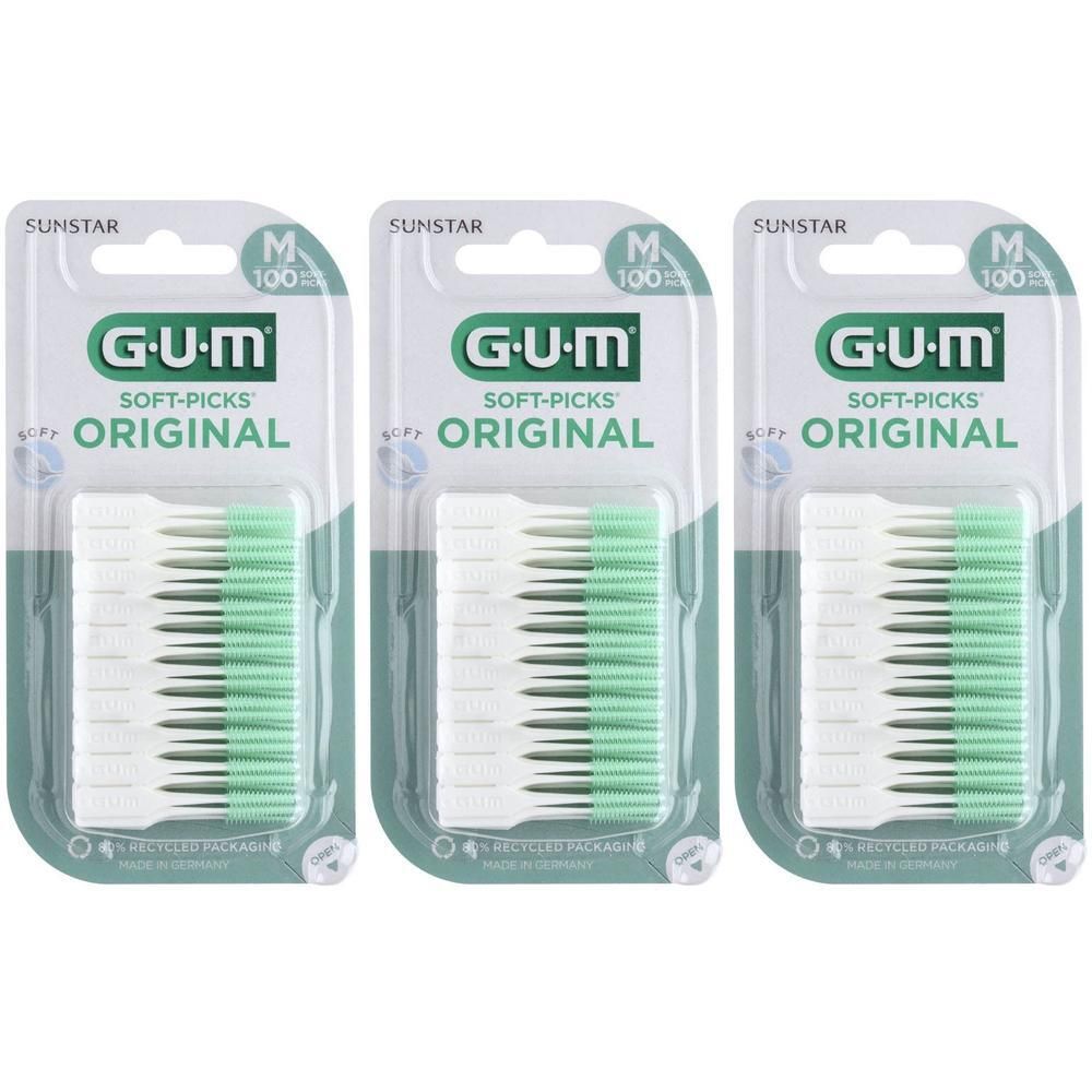 Drie verpakkingen GUM® SOFT-PICKS® ORIGINAL M. Elke verpakking bevat tandenstokers. Verpakking met productnaam en logo.