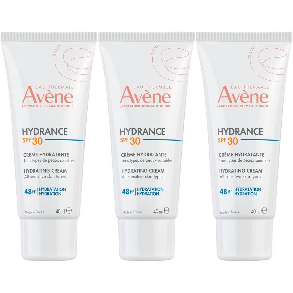 Trois tubes de Hydrance Crème Hydratante SPF30. Blancs, avec logo Avene et informations produit.