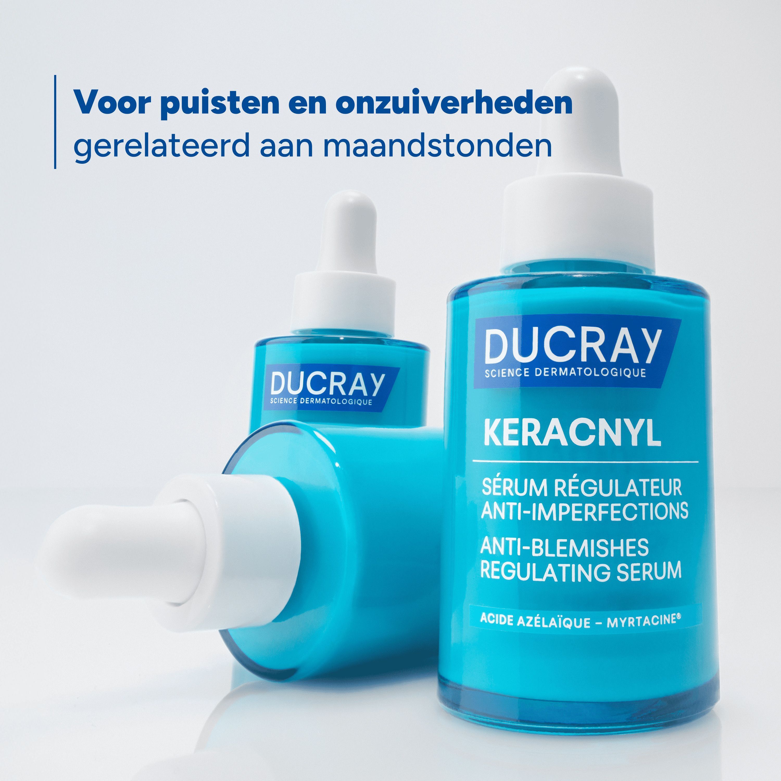 Twee Ducray Keracnyl serumflessen. Tekst: Voor puisten en onzuiverheden gerelateerd aan maandstonden.