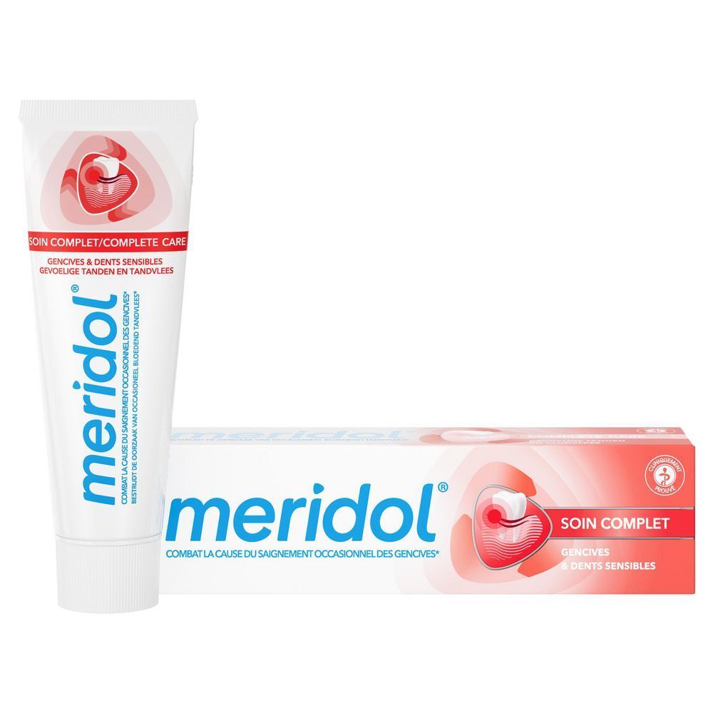 Tube en doos tandpasta. Merk meridol®, Soin Complet, Gencives & Dents Sensibles. Witte en rode verpakking.