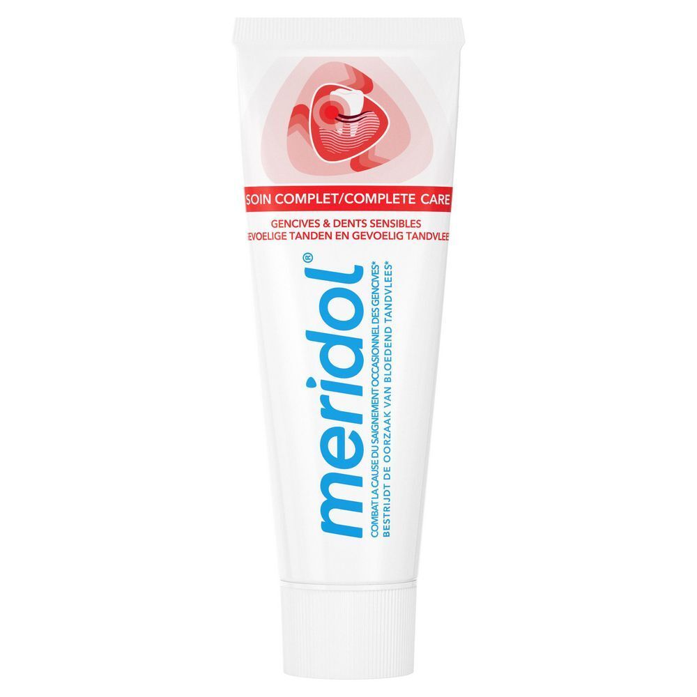 Tube tandpasta. Merk meridol®, Soin Complet, Gencives & Dents Sensibles. Witte tube met rood design.