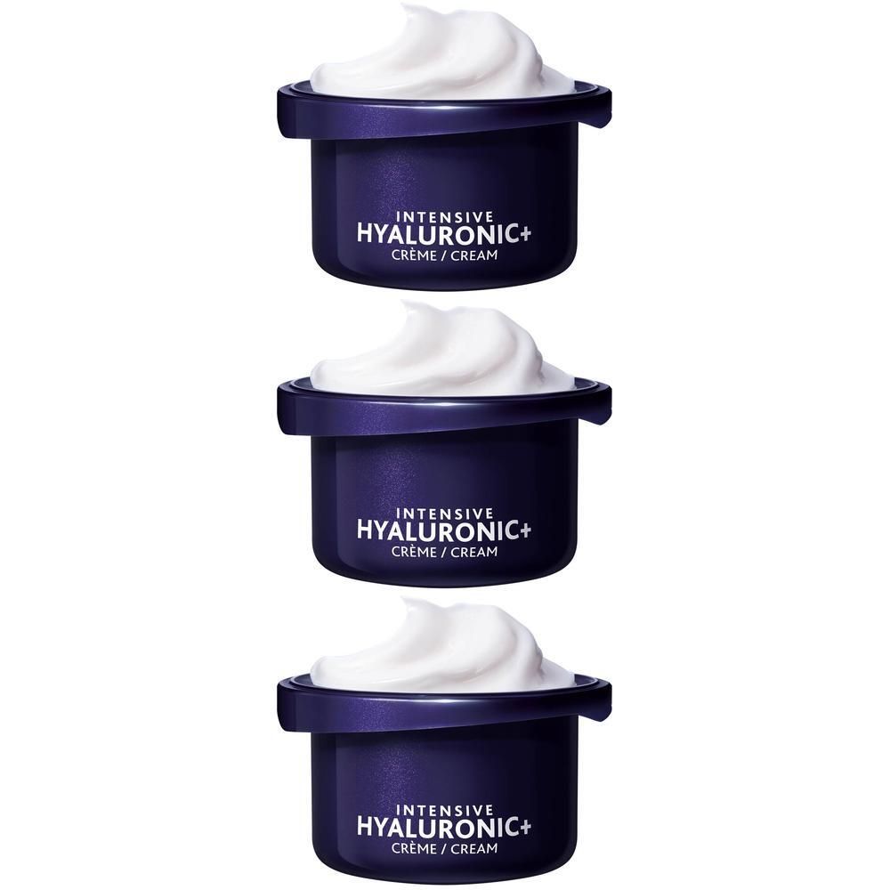 Trois pots de crème bleu foncé avec crème blanche. Inscription: INTENSIVE HYALURONIC+ CREME / CREAM.