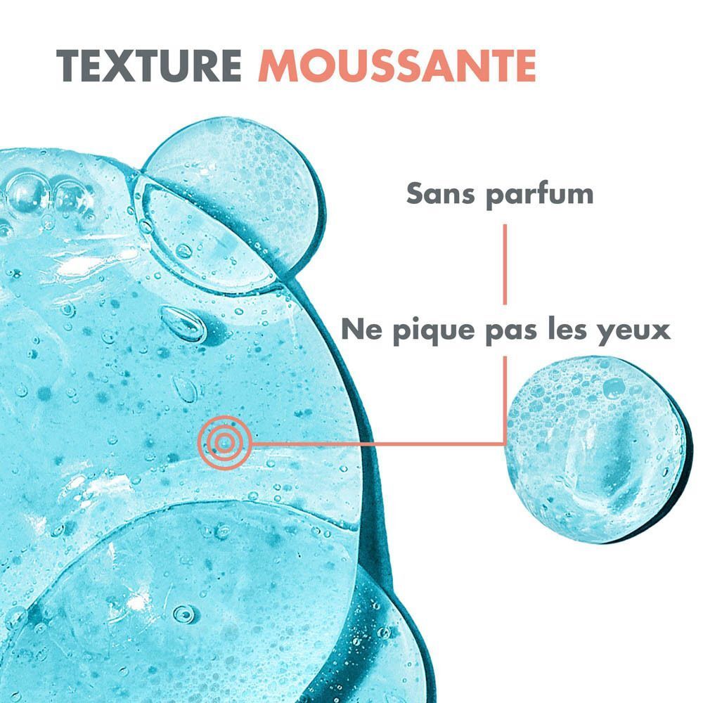 Gros plan sur gel bleu avec bulles de mousse. Texte: Texture moussante, sans parfum, ne pique pas les yeux.