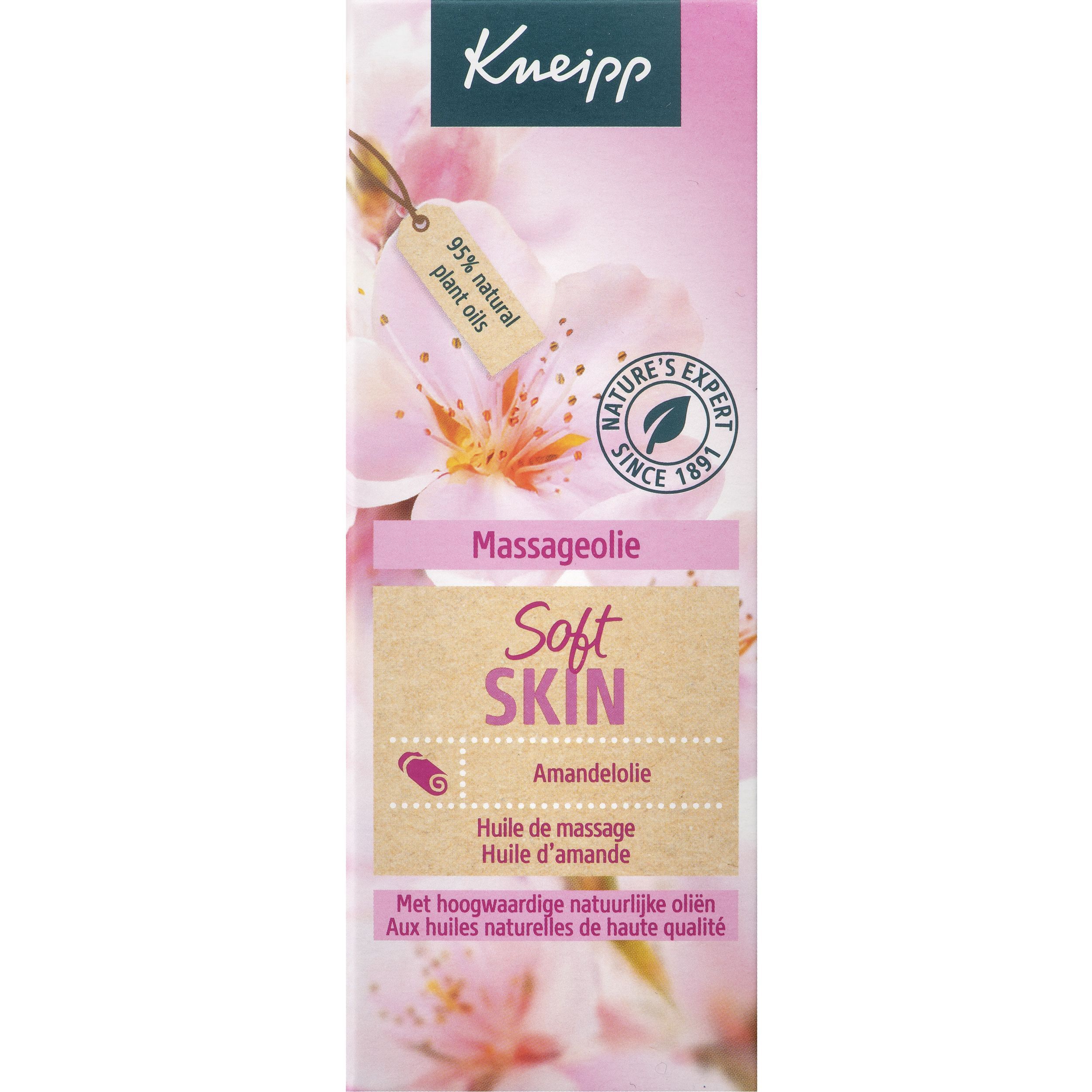 Roze verpakking met opschrift Kneipp, Massageolie, Soft Skin, Amandelolie. 95% natuurlijke plantaardige oliën. Bloemenachtergrond.